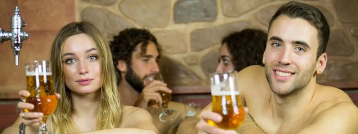 People drinking beer inside the Spa
