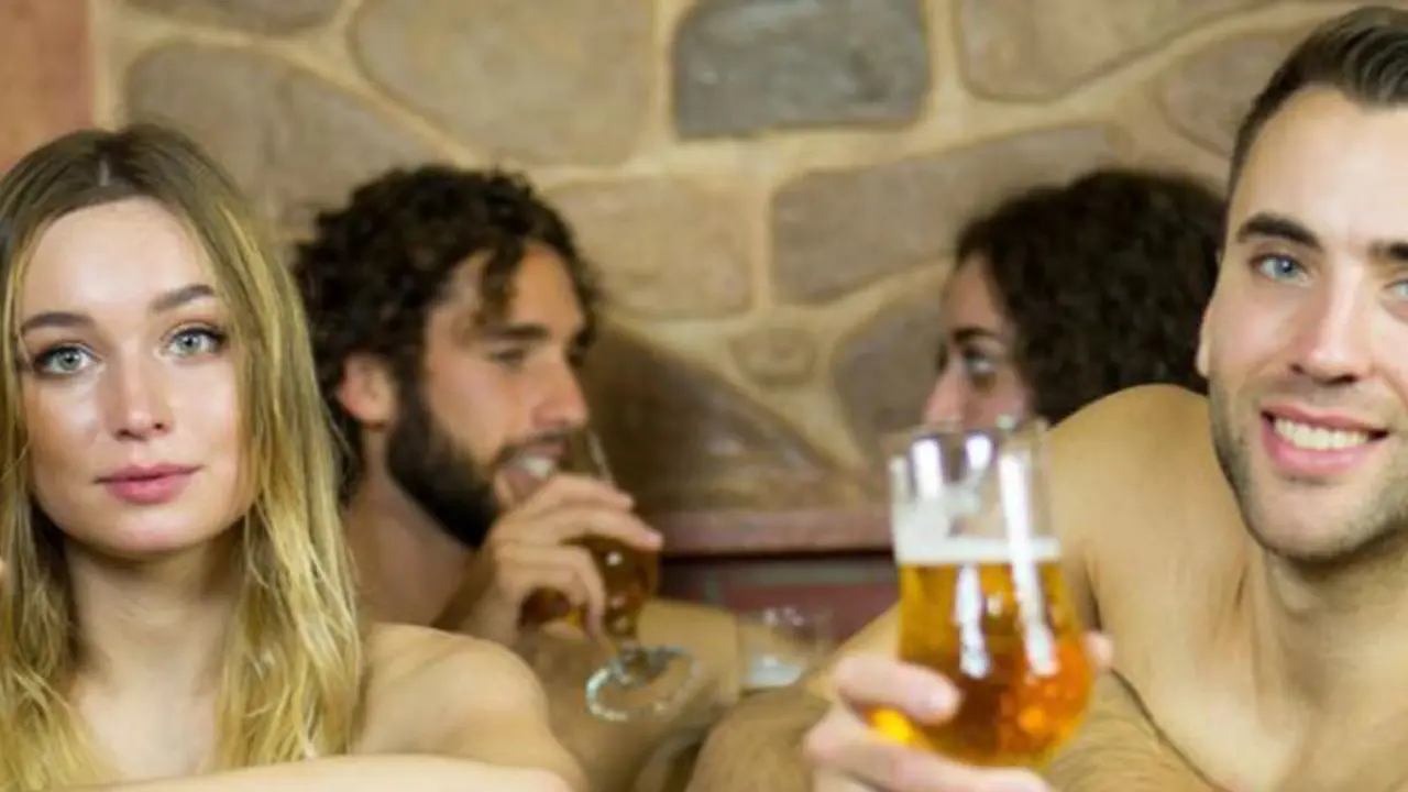 People drinking beer inside the Spa