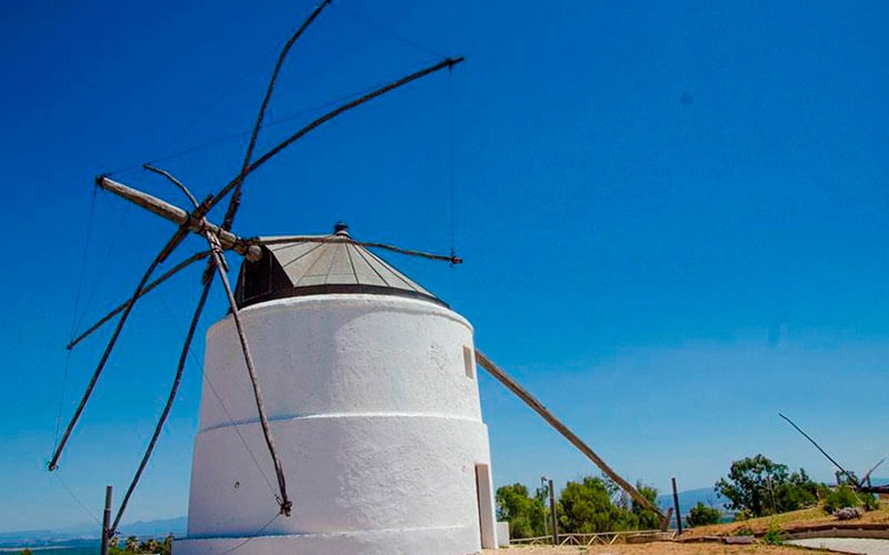 a windmill against blue sky