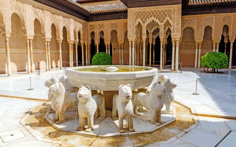 A fountain with lion sculptures in a courtyard