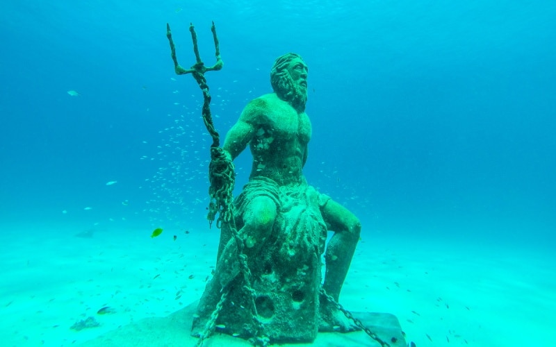Underwater statue of God Poseidon