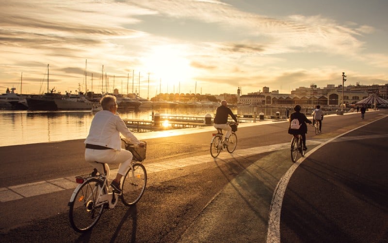Some people riding a bike in Valencia.