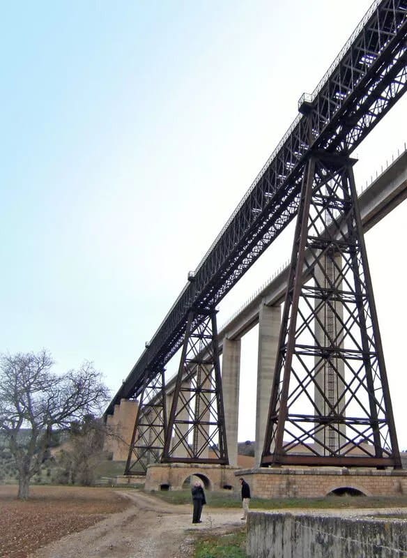 A large bridge, resembling a metalic structure, in the countryside