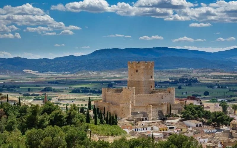 A castle that stands out in a green valley