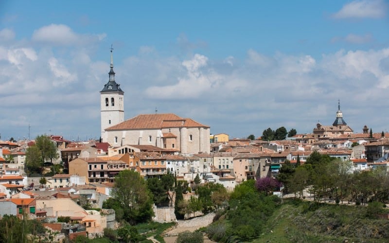 A panoramic view of a village, the tower of a church standing out