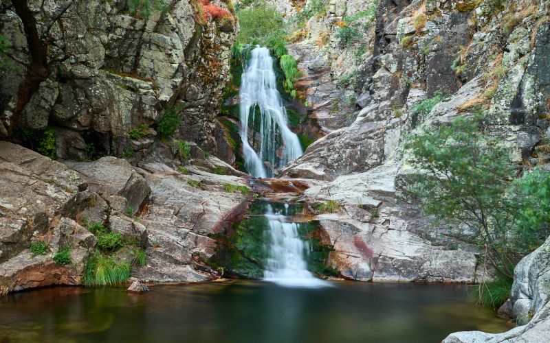 A waterfall flowing on a rock face