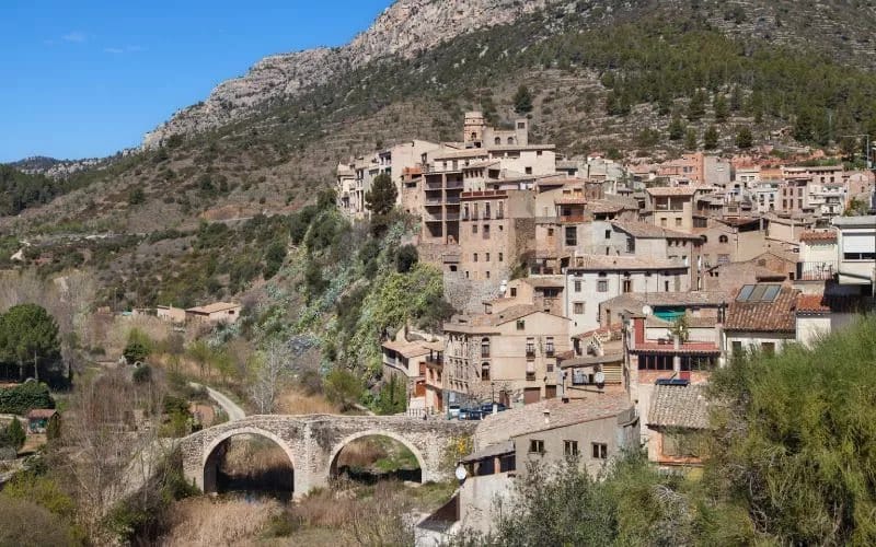 A village and a bridge on a mountain slope