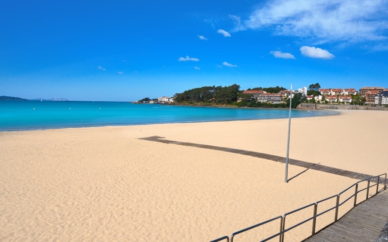 A white sand beach with calm waters