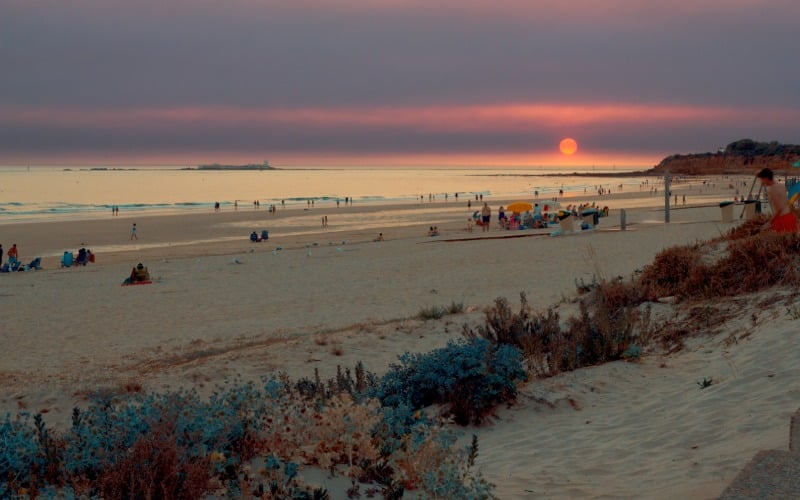 A beautiful sunset with shades of purple and orange seen fron the beach