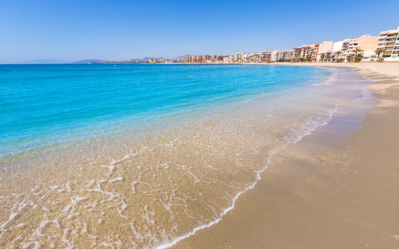 A close view of the seashore in a blue beach