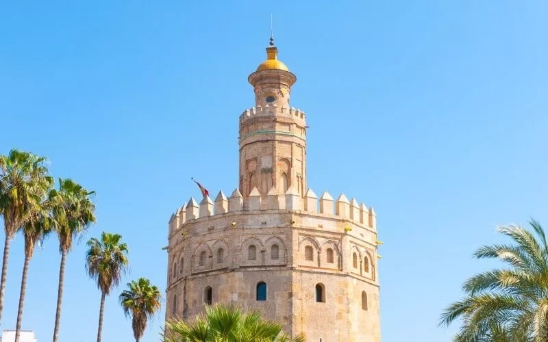 A beautifully decorated tower against the blue sky
