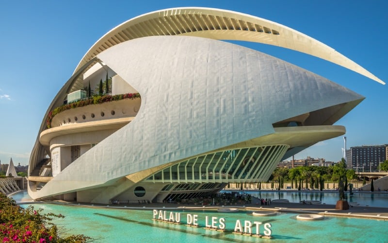 A white futuristic building above water