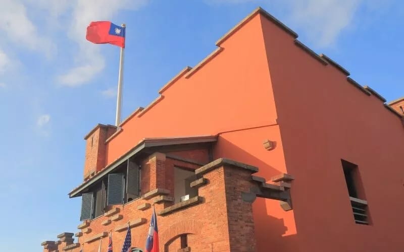 An orange building against the blue sky
