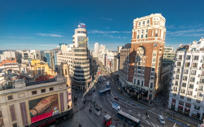 An aerial view of a street with large buildings