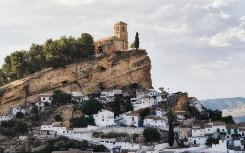 The castle of Montefrío rises over the white houses of the village