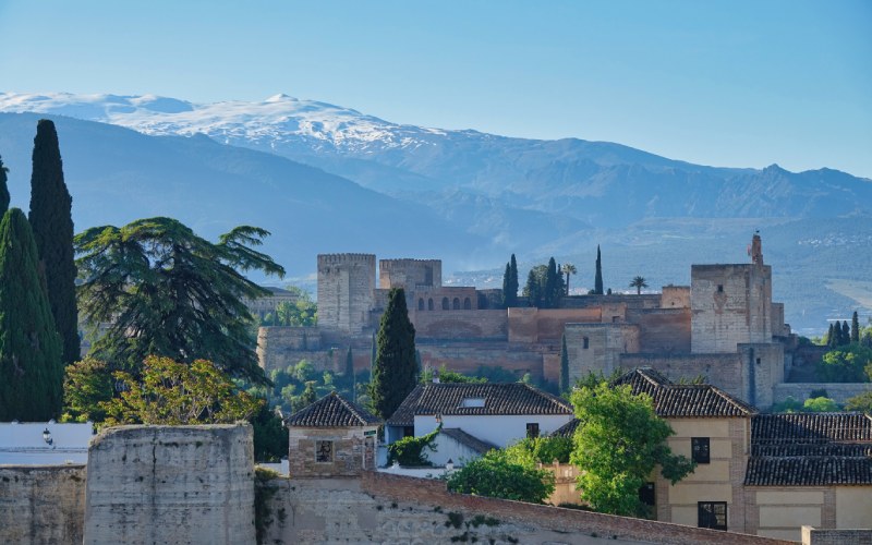 Houses and old buildings with mountains in the background
