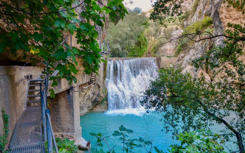 A waterfall and a catwalk on the left