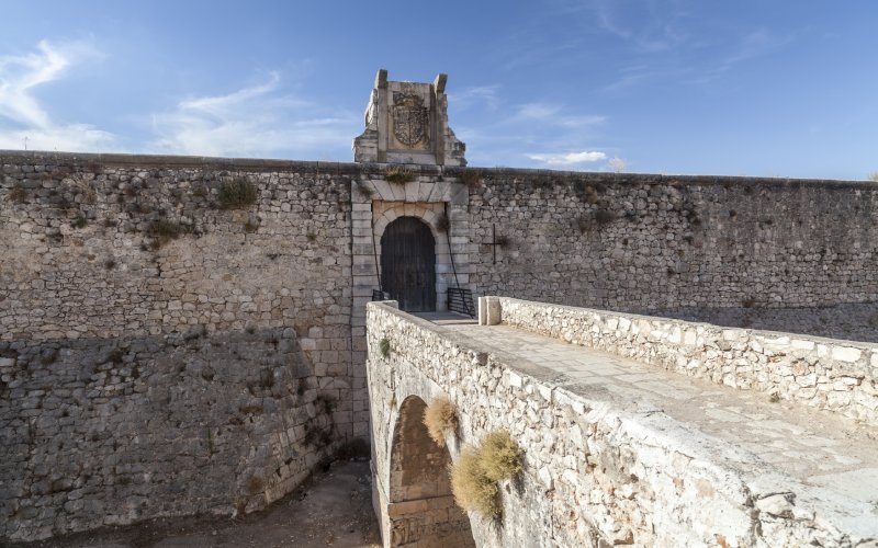 A bridge and the walls of an old castle