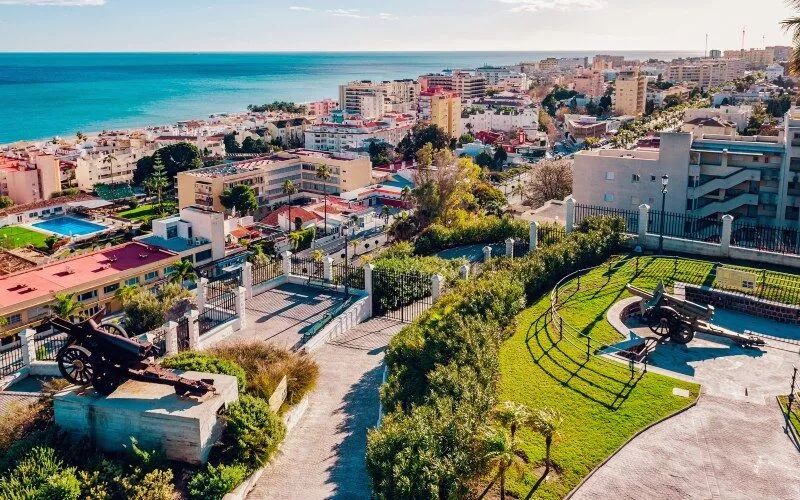 A panoramic view of a city and the beach in the background