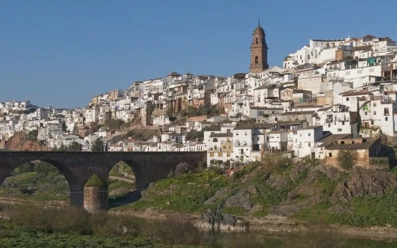 A bridge and a town with white houses