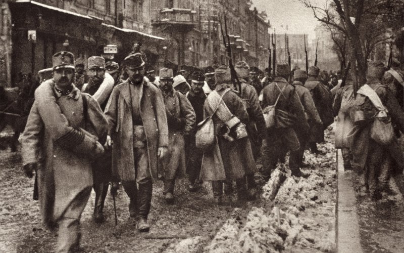 A black and white picture of soldiers marching