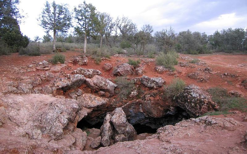 A cave on reddish rocks