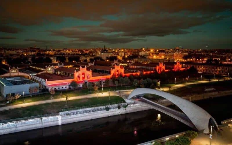 Madrid's Matadero at night next to the river