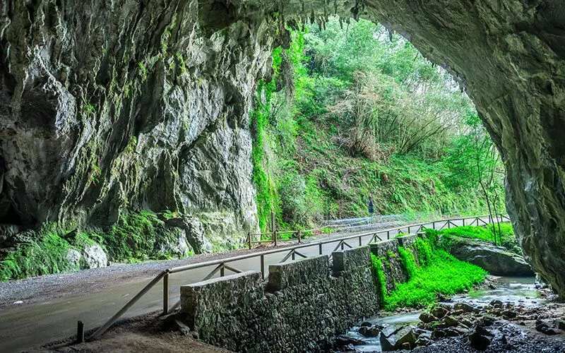 A cave with a road crossing it