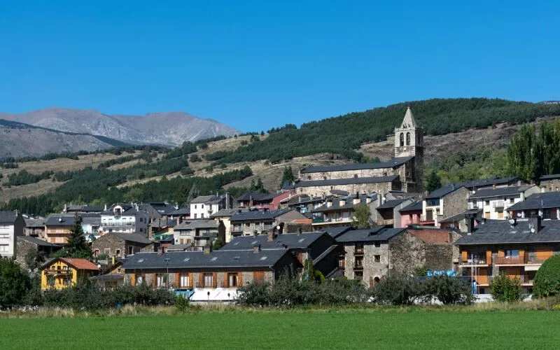 A village with black tiles and a church
