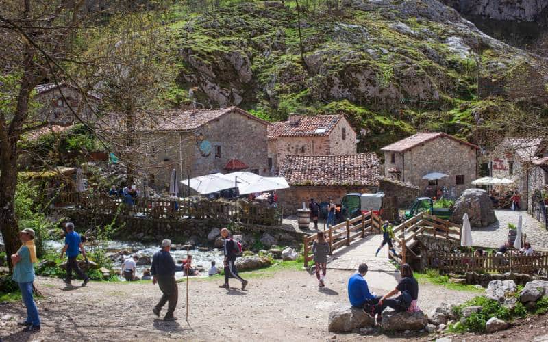 The village of Bulnes with some hikers