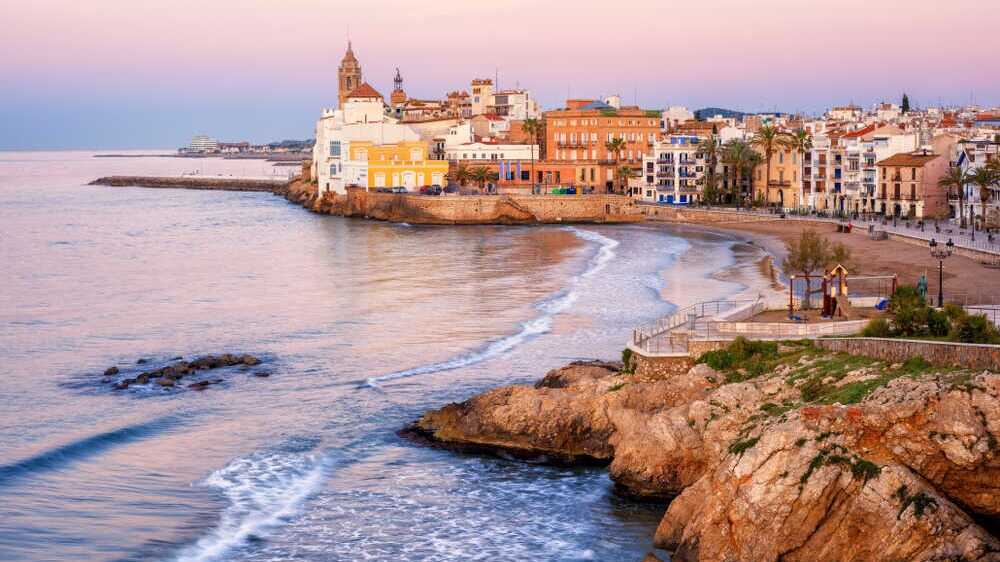 Sant Sebastià Beach in Sitges. | Shutterstock