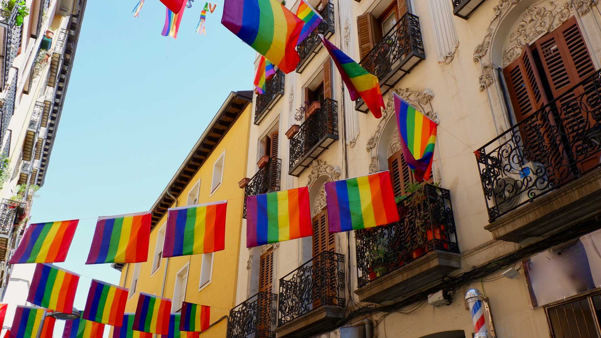 Rainbow flags in the streets of Madrid’s Chueca neighbourhood during Gay Pride month. | Shutterstock